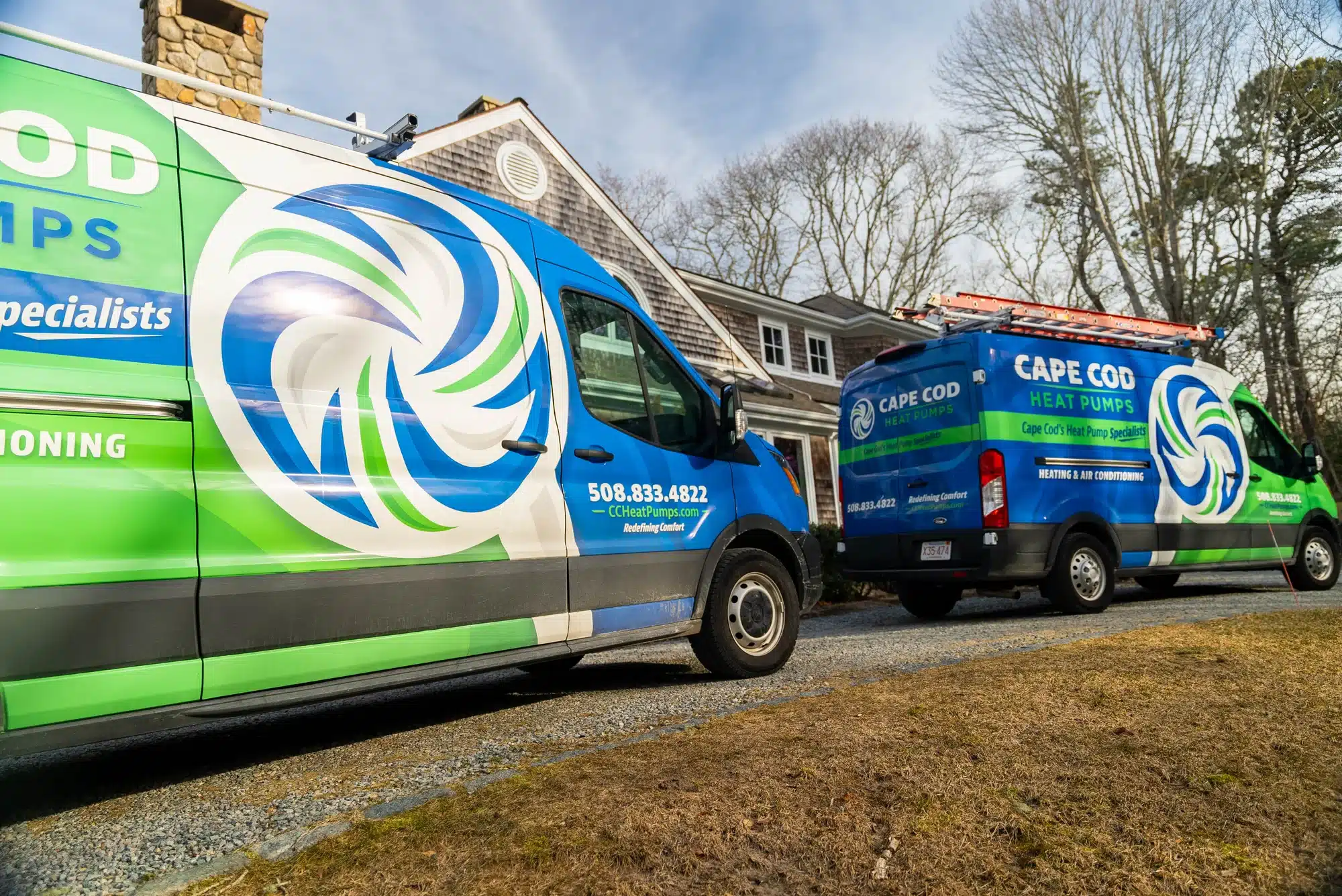 2 Cape Cod trucks outside of residential home on Cape Cod, MA.